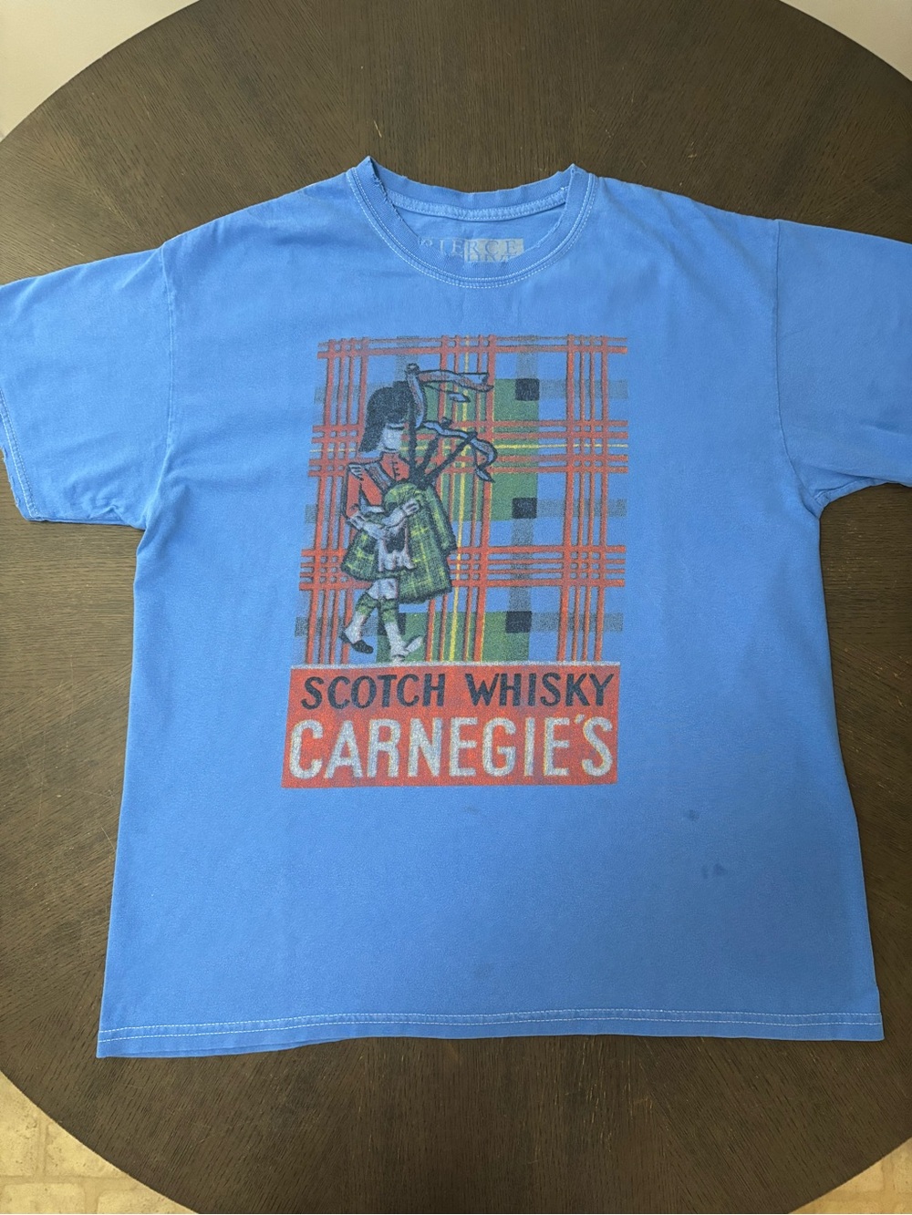 Buckle Light Blue Graphic Tee with Red and Green Plaid Print